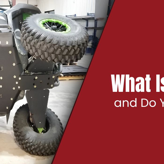 Trail Armor UTV skid plate installed on underside of a green UTV, what is a skid plate and do you need one?
