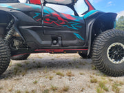 Trail Armor black slider nerf bar full side profile on Kawasaki KRX 1000 Special Edition outdoors