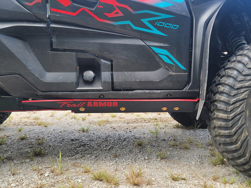 Trail Armor black slider nerf bar red accent stripe and logo on Kawasaki KRX 1000 Special Edition
