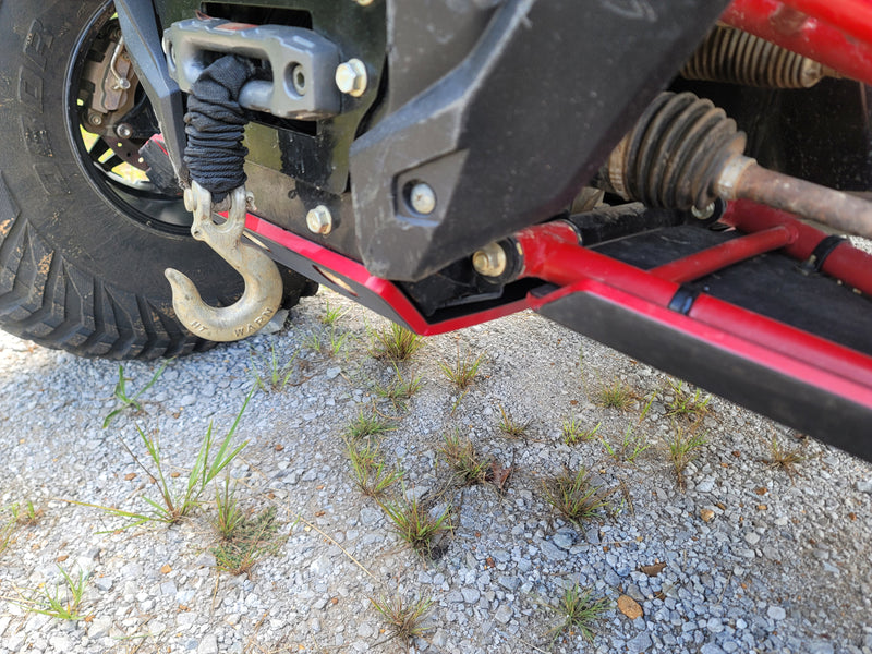 Trail Armor red front skid plate nose and winch hook close-up on Kawasaki KRX 1000 gravel