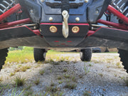 Trail Armor red front skid plate with winch hook front ground-level view on Kawasaki KRX 1000
