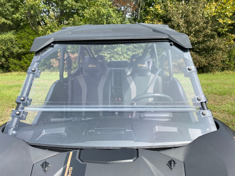 Trail Armor CoolFlo Windshield closeup on Kawasaki KRX 4 1000 showing clear panel and clamp hardware
