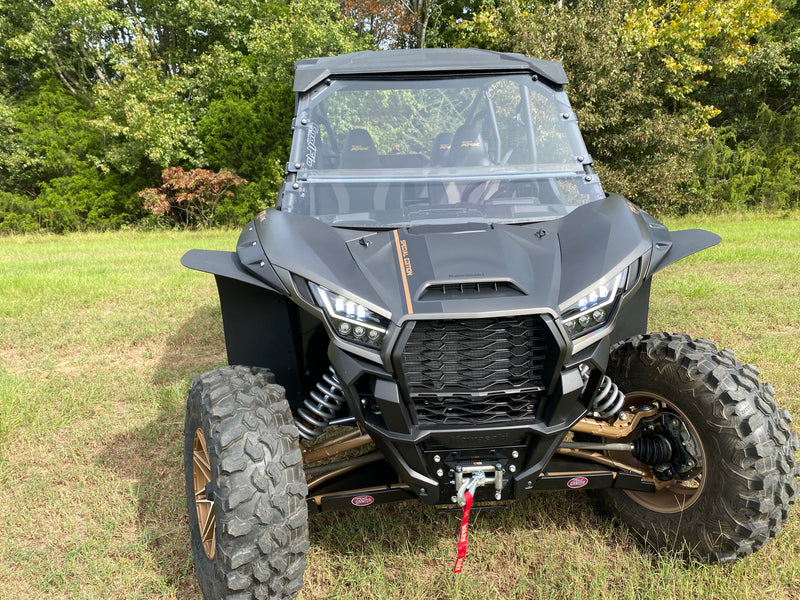 Trail Armor CoolFlo Windshield on Kawasaki KRX 4 1000 full front view with mud flaps outdoors
