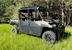 Trail Armor half doors installed on a Polaris Ranger Crew 1000 in a grass field