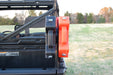 Trail Armor RotopaX mount with clamps holding packs on a Polaris Ranger roll bar