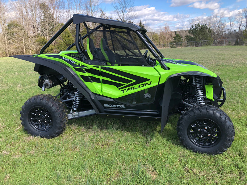 Trail Armor mud flap fender extensions full UTV side view on green Honda Talon 1000R outdoor field shot