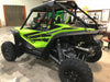 Trail Armor mud flap fender extensions installed on green Honda Talon 1000R UTV full side view
