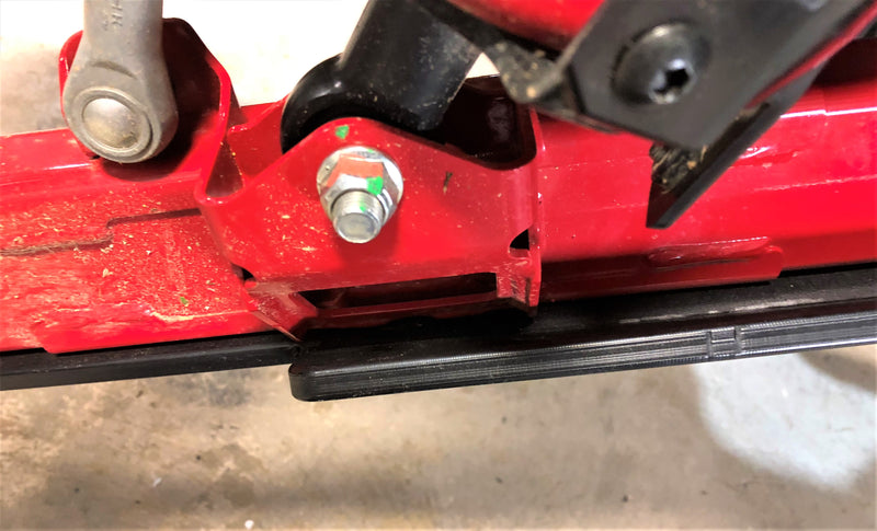 Trail Armor iMpact trailing arm guard bracket and bolt mounting detail on Honda Talon 1000R RS Fox Live Valve