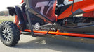 Trail Armor full skids rock slider and door area with logo badge on orange Honda Talon 1000X-4 Fox Live Valve 2020-2026