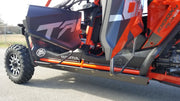 Trail Armor full skids complete side profile view with rock sliders on orange Honda Talon 1000X-4 Fox Live Valve 2020-2026