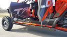Trail Armor full skids complete side profile view with rock sliders on orange Honda Talon 1000X-4 Fox Live Valve 2020-2026