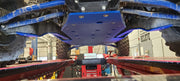 Trail Armor blue skid plate undercarriage view installed on Kawasaki KRX 1000 in shop