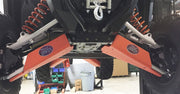 Trail Armor iMpact A-Arm Guards installed on [Model] underside orange finish