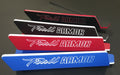 Trail Armor branded name plate emblems shown in red black and blue color options