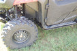 Trail Armor Honda Pioneer 700 Full Skid Plate Installed – Front Wheel and Rocker Panel Corner View with Suspension