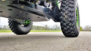 Trail Armor black full skid plates ground-level underside view on Kawasaki KRX 1000 outdoors