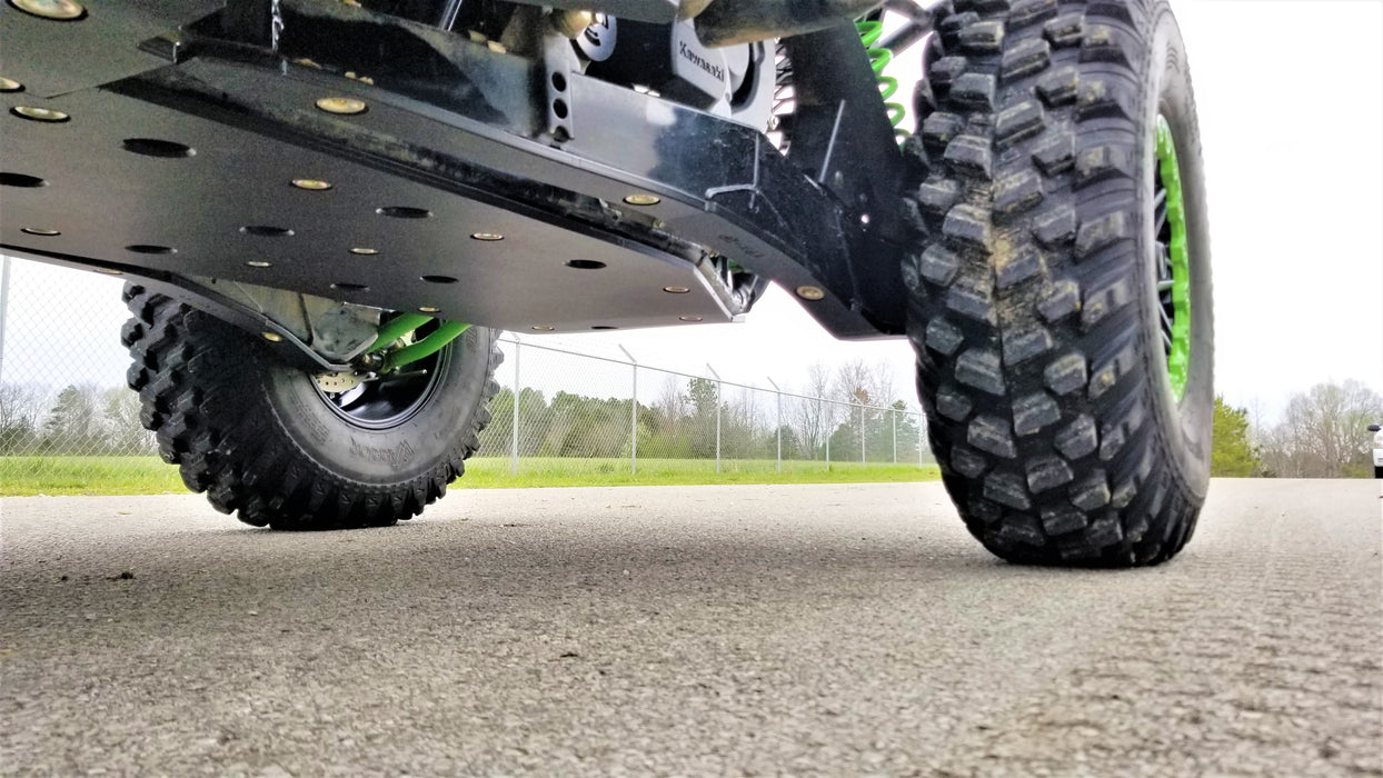 Trail Armor black full skid plates ground-level underside view on Kawasaki KRX 1000 outdoors