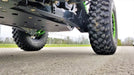 Trail Armor black full skid plates ground-level underside view on Kawasaki KRX 1000 outdoors