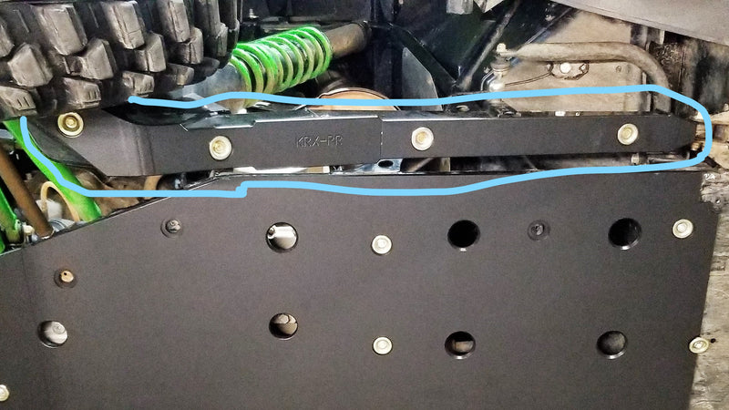Trail Armor black iMpact Trailing Arm Guard installed underside view highlighted on Kawasaki KRX 1000