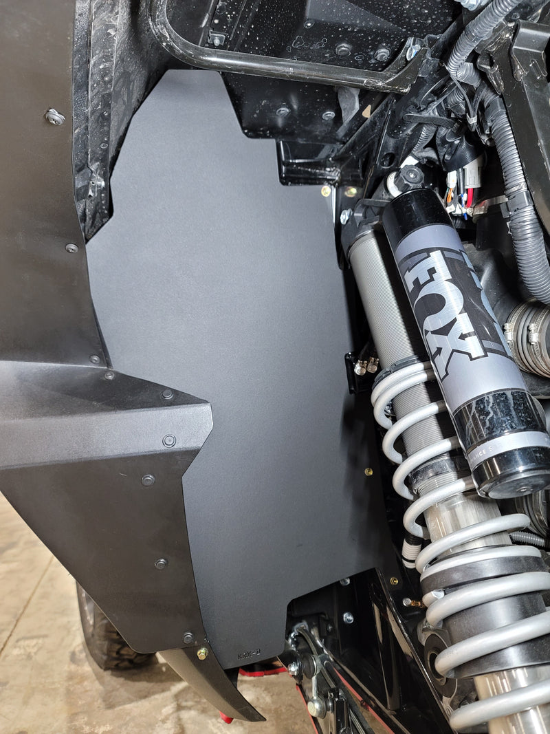 Trail Armor black inner fender liner installed on Kawasaki KRX 1000 alongside FOX shock 2020-2026