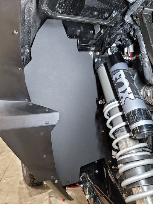 Trail Armor black inner fender liner installed on Kawasaki KRX 1000 alongside FOX shock 2020-2026