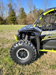 Trail Armor black mud flap fender extension front wheel arch close-up on Kawasaki KRX 1000 outdoors