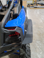 Trail Armor black mud flap fender extension rear quarter installed on Kawasaki KRX 1000 in shop