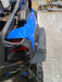 Trail Armor black mud flap fender extension rear quarter installed on Kawasaki KRX 1000 in shop