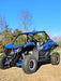 Trail Armor black mud flap fender extensions full side view on Kawasaki KRX 1000 outdoor blue sky