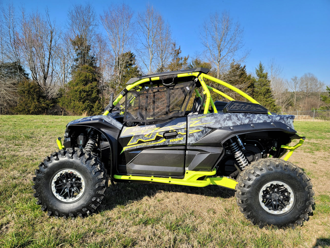 Trail Armor black mud flap fender extensions on Kawasaki Teryx KRX 1000 neon yellow build outdoor