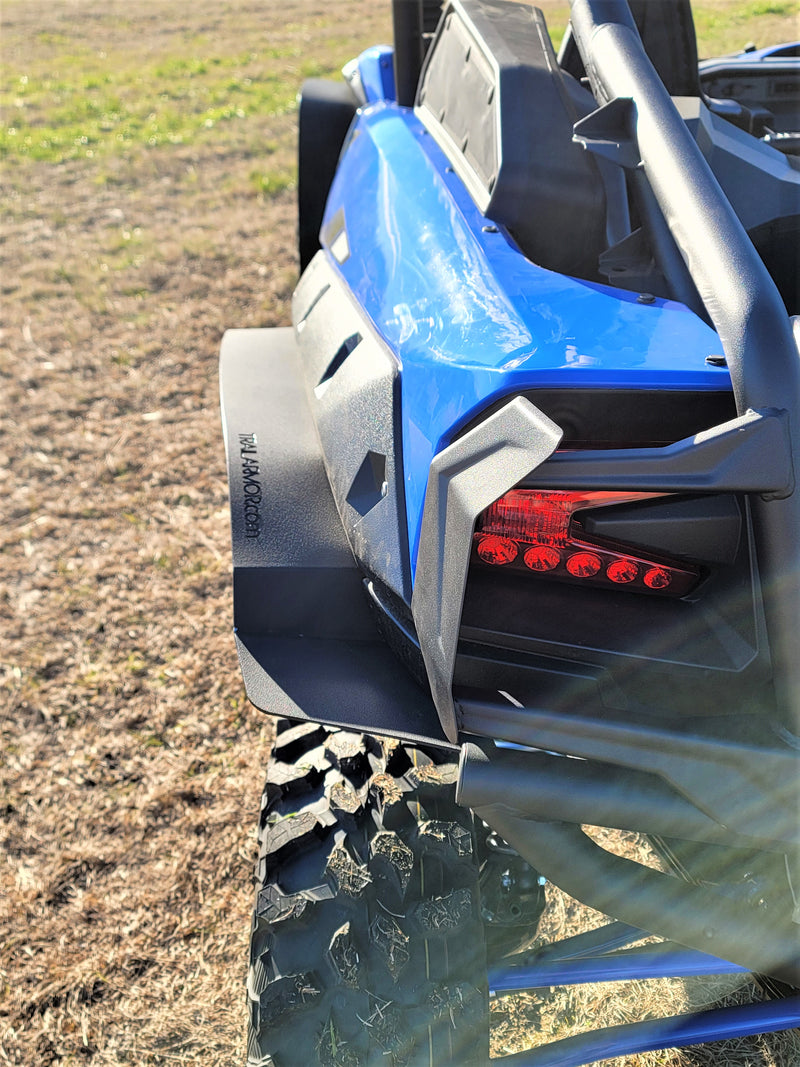 Trail Armor black rear mud flap fender extension with embossed logo on Kawasaki KRX 1000 blue outdoor