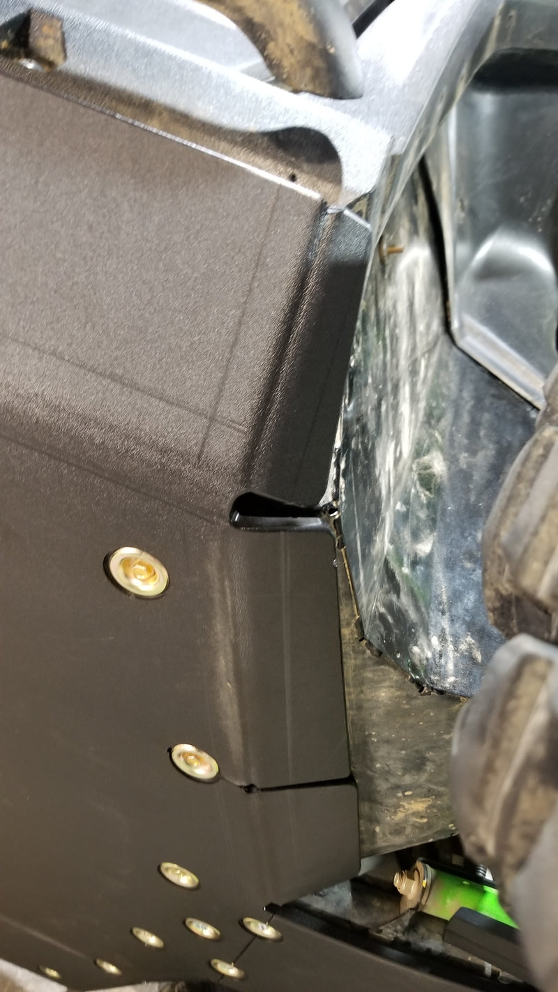 Trail Armor black skid plate front edge fitment detail on Kawasaki KRX 1000 undercarriage