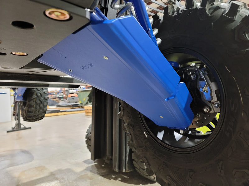Trail Armor blue iMpact Front Guard KRX-FF underside close-up next to wheel and rotor on KRX 1000