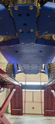 Trail Armor blue full skid plate belly view on lift showing bolt pattern Kawasaki KRX 1000