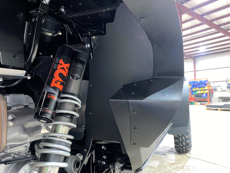 Trail Armor black inner fender liner full panel view with FOX Live Valve shock on Kawasaki KRX 4 1000