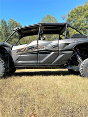 Trail Armor black integrated side skid plates full side profile on Kawasaki Teryx KRX 4 1000 outdoors