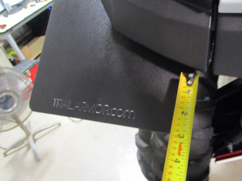 Trail Armor mud flap fender extension closeup with brand logo and clearance