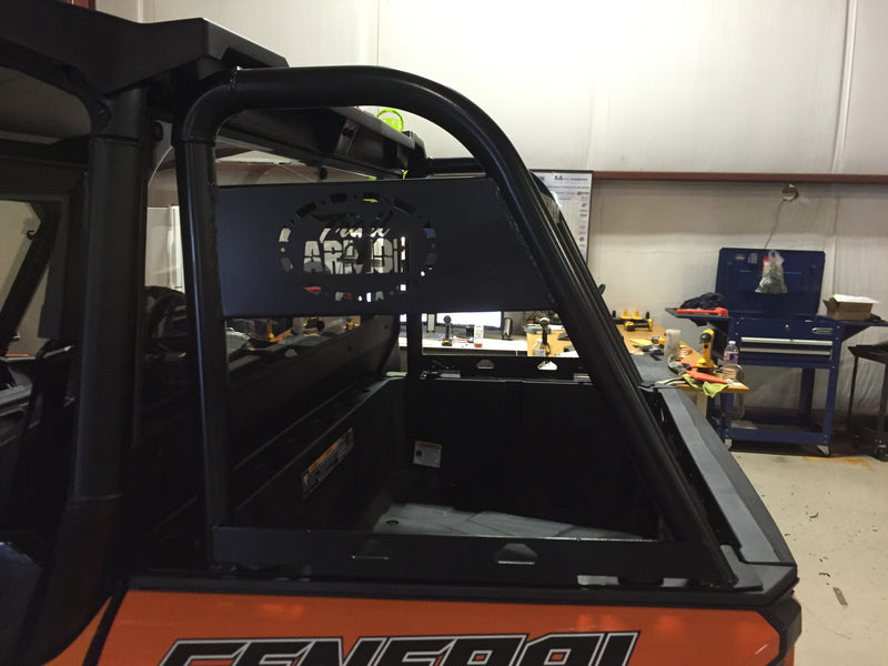 Trail Armor rear rack logo plate indoor closeup orange Polaris General 1000