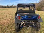 Trail Armor rear window dust shield installed on blue Polaris General outdoor