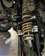 Trail Armor iMpact A-Arm Guard olive green near coilover on Polaris General XP