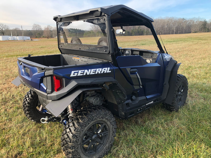 Trail Armor rear window dust shield installed on blue Polaris General XP