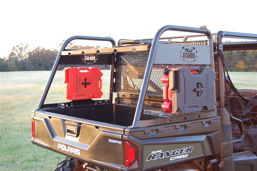 Trail Armor RotopaX mount with red fuel packs installed on a Polaris Ranger Crew bed