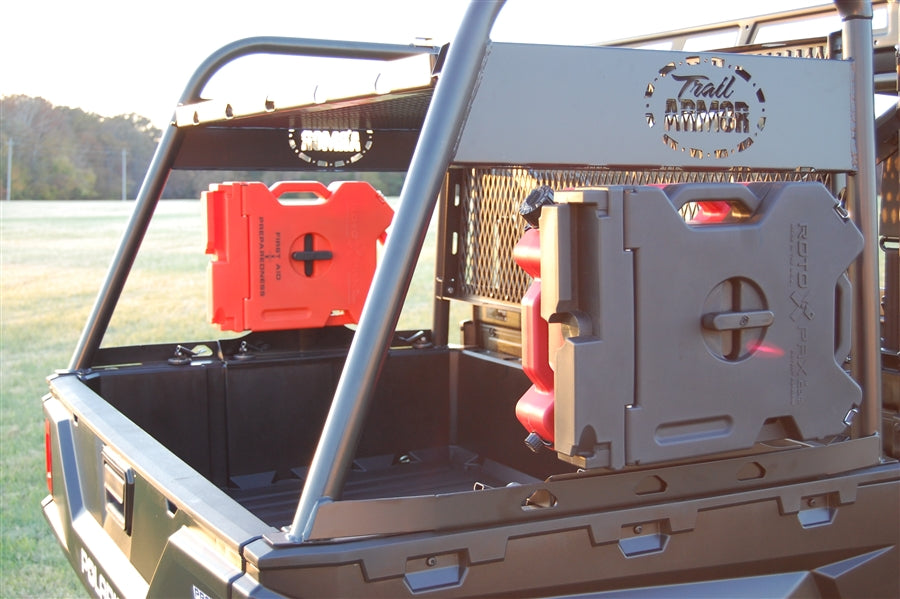 Trail Armor RotopaX mount with red and gray packs on a Polaris Ranger bed rack