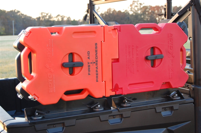 Trail Armor RotopaX mount close up with first aid and gasoline packs on a Ranger tailgate