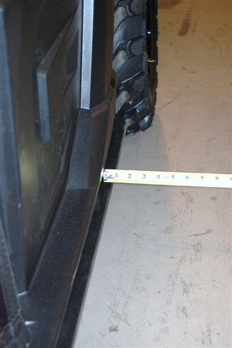 Trail Armor skid plate edge measured against a tire on a Polaris Ranger XP 900 1000 Crew