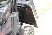 Trail Armor underbed mud shield panel installed under a Polaris Ranger XP near the rear wheel