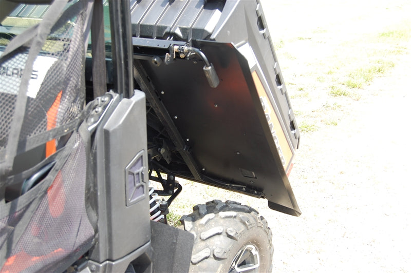 Trail Armor underbed mud shield panel installed under a Polaris Ranger XP near the rear wheel