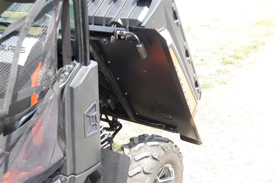 Trail Armor underbed mud shield panel installed under a Polaris Ranger XP near the rear wheel