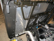 Trail Armor underbed mud shield installed near the engine bay of a Polaris Ranger XP 900