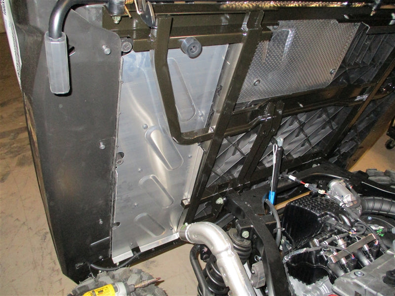 Trail Armor underbed mud shield installed near the engine bay of a Polaris Ranger XP 900